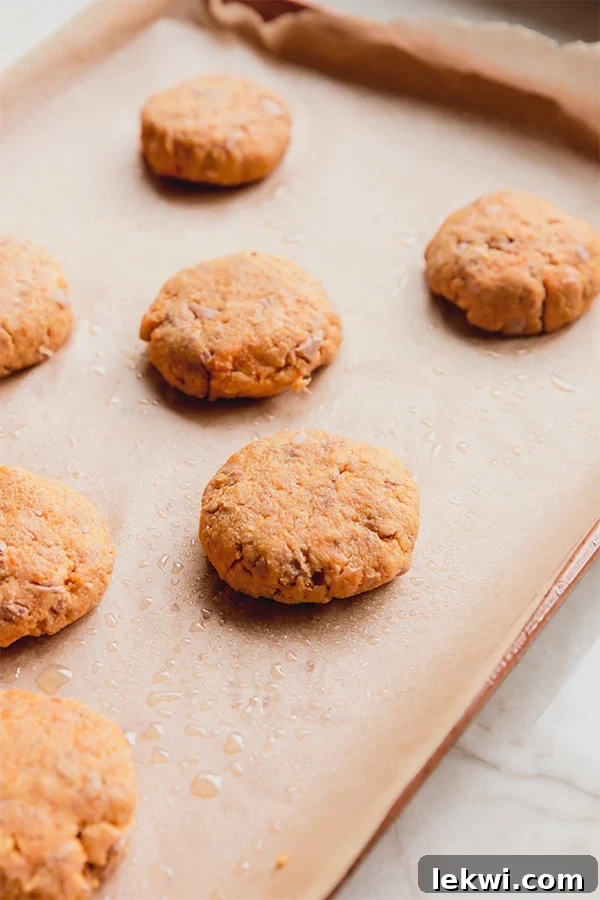 A baking tray with sweet potato tuna cakes.