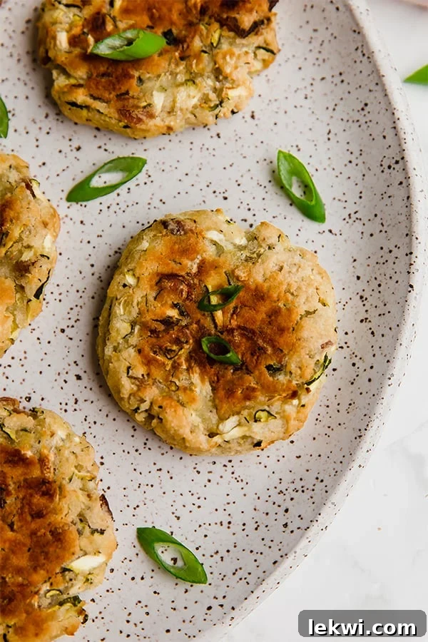 Zucchini fritter on a plate.