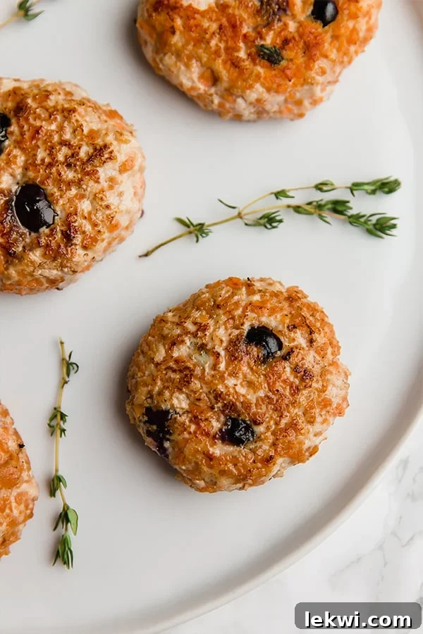 Blueberry sausage patties on a plate.