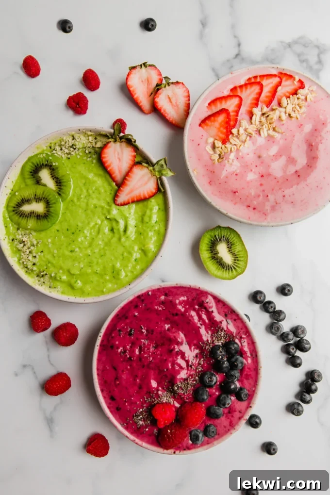 Three colorful smoothie bowls.