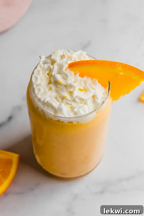 Creamsicle smoothie topped with whipped cream.