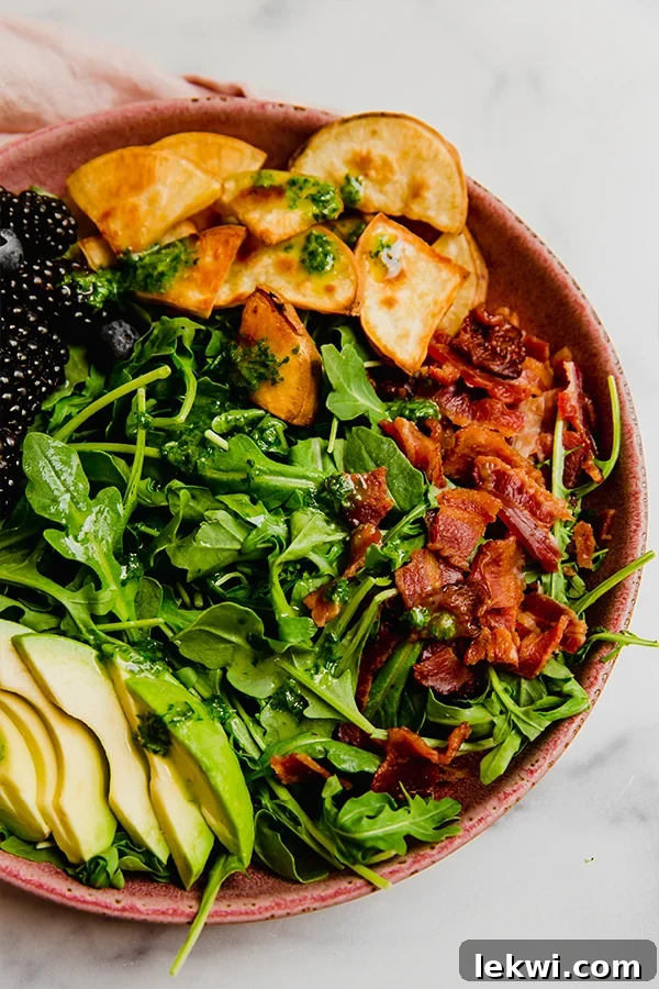 Breakfast salad with blackberries in a bowl.