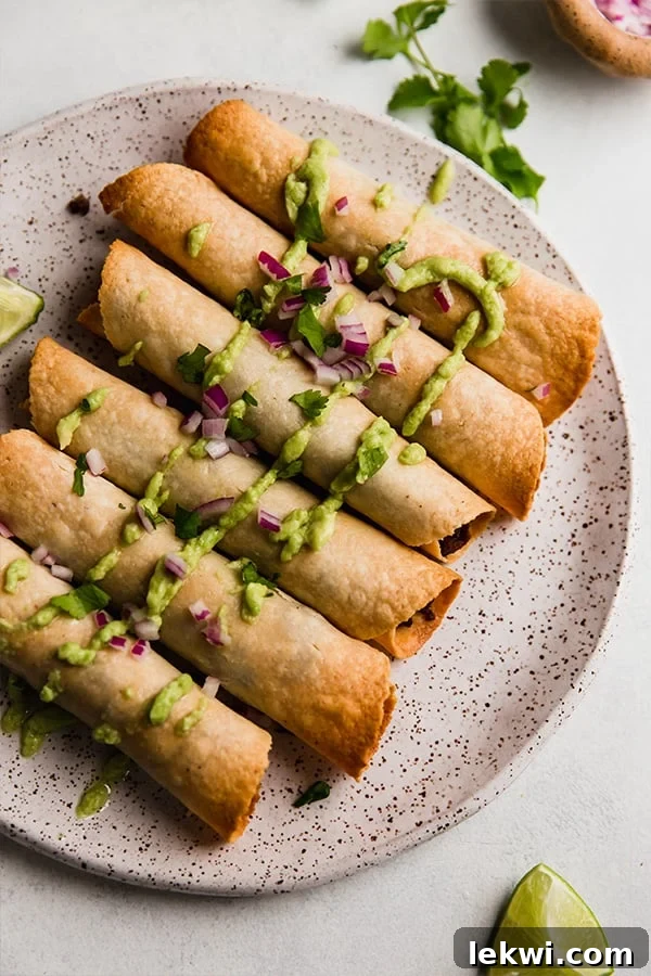 Breakfast taquitos on a plate.