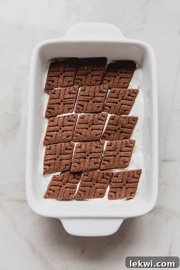 A dish with the first layer of the ice box cake layered in.