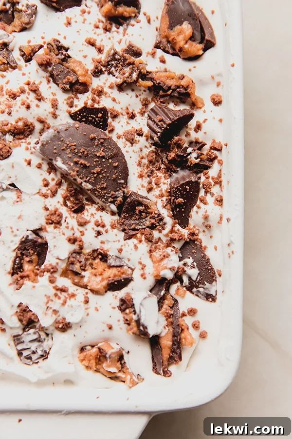 A close up photo of the ice box cake with crushed almond butter cup topping.