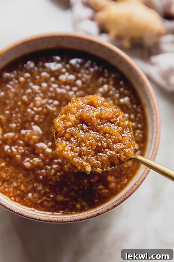 Spoon with a scoop of hibachi ginger sauce.
