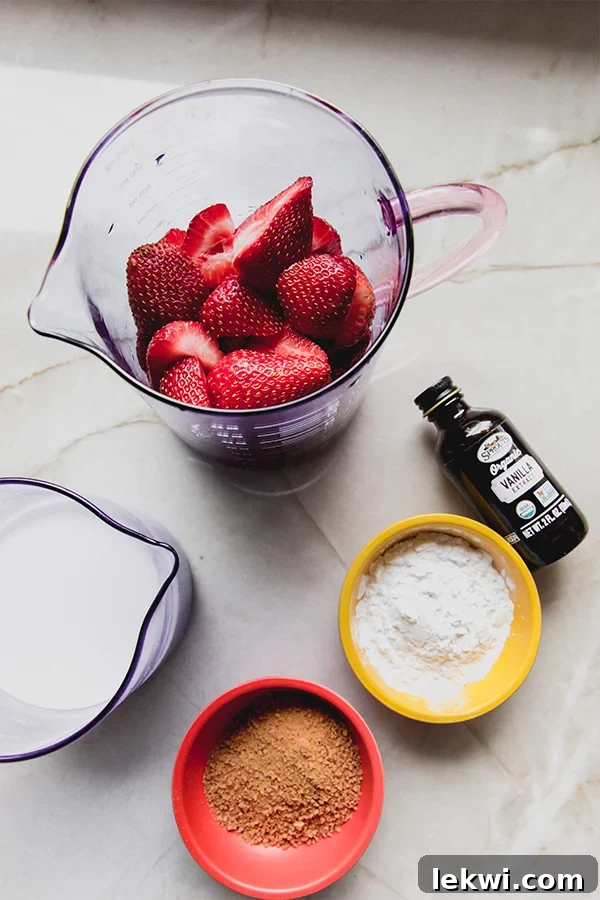 A vibrant display of fresh ingredients, including ripe strawberries, coconut milk, and other key components, arranged on a rustic surface, ready to be transformed into a delectable strawberries and cream pudding.
