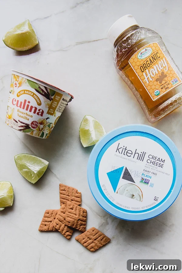 An overhead shot showcasing all the fresh, natural ingredients for a healthy key lime pie dip neatly arranged on a clean kitchen counter, highlighting the simple recipe.