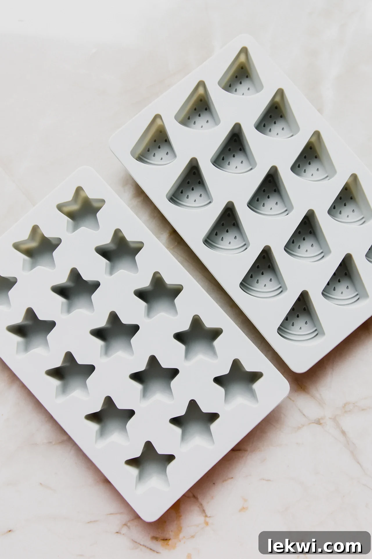 A collection of silicone gummy molds in various fun shapes, ready for homemade candy production.