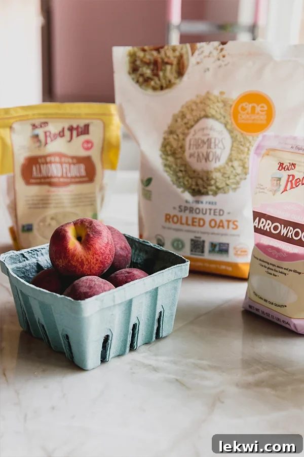 All the gluten-free and dairy-free ingredients laid out on a table, ready to make air fryer peach crisp.