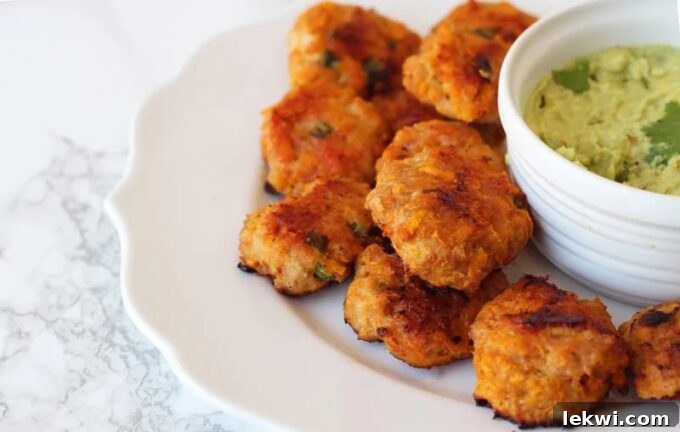 Plate of sweet potato chicken poppers served with roasted broccoli.