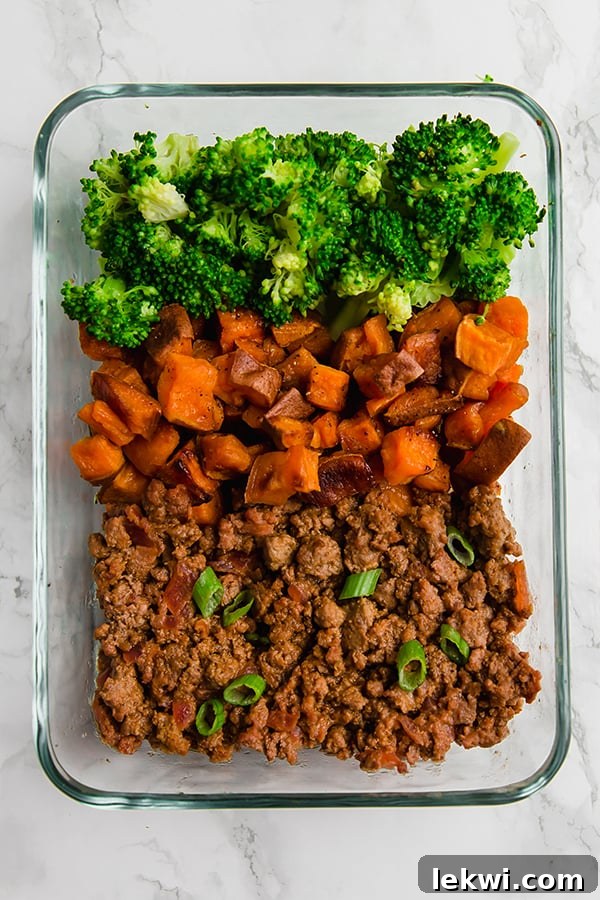 Sloppy Joe meat with colorful vegetables in a glass meal prep container.
