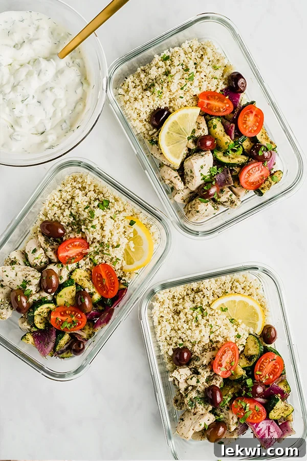 Greek chicken meal prep bowls with vegetables and dairy-free tzatziki.