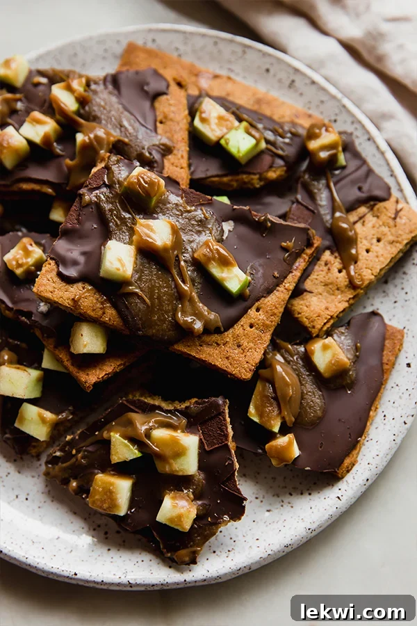 A platter stacked with caramel apple graham cracker bark.
