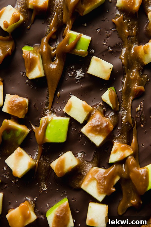 Caramel apple graham cracker bark with green apple pieces.