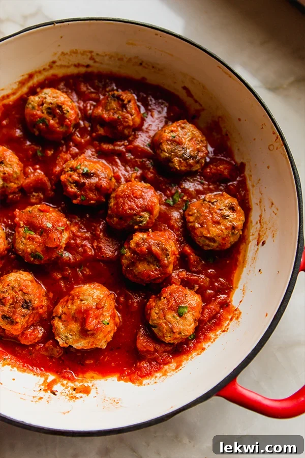 Wholesome Hidden Veggie Meatballs Gluten and Dairy Free 6 A pot filled with perfectly cooked hidden veggie meatballs simmering in a rich sauce.