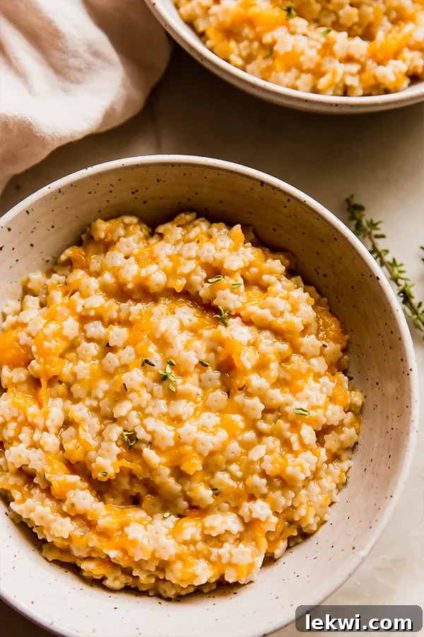 A bowl of butternut squash stelline next to another bowl of butternut squash stelline.