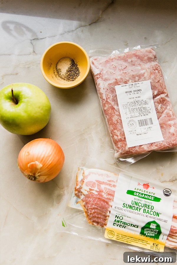 All the fresh ingredients for making apple chicken burgers laid out before preparation.