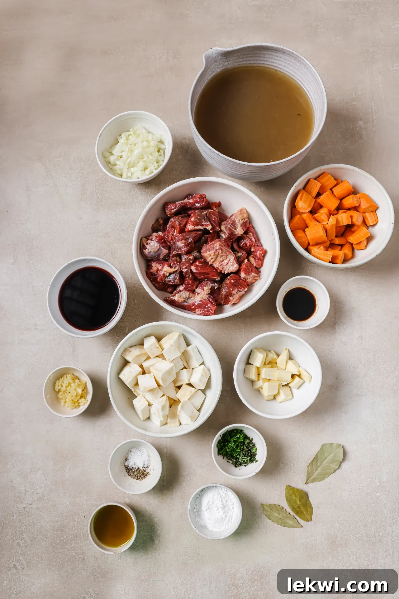 Dutch oven beef stew ingredients in seperate bowls. 