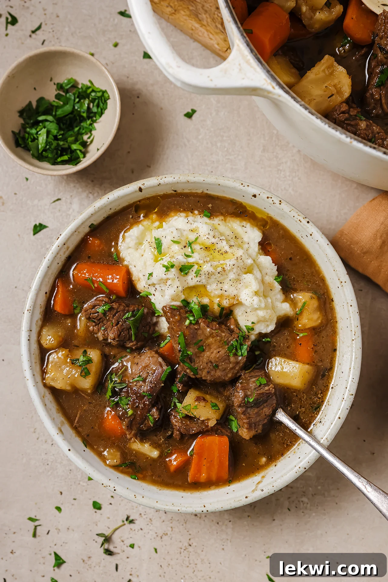 Dutch oven beef stew served with mashed potatoes. 
