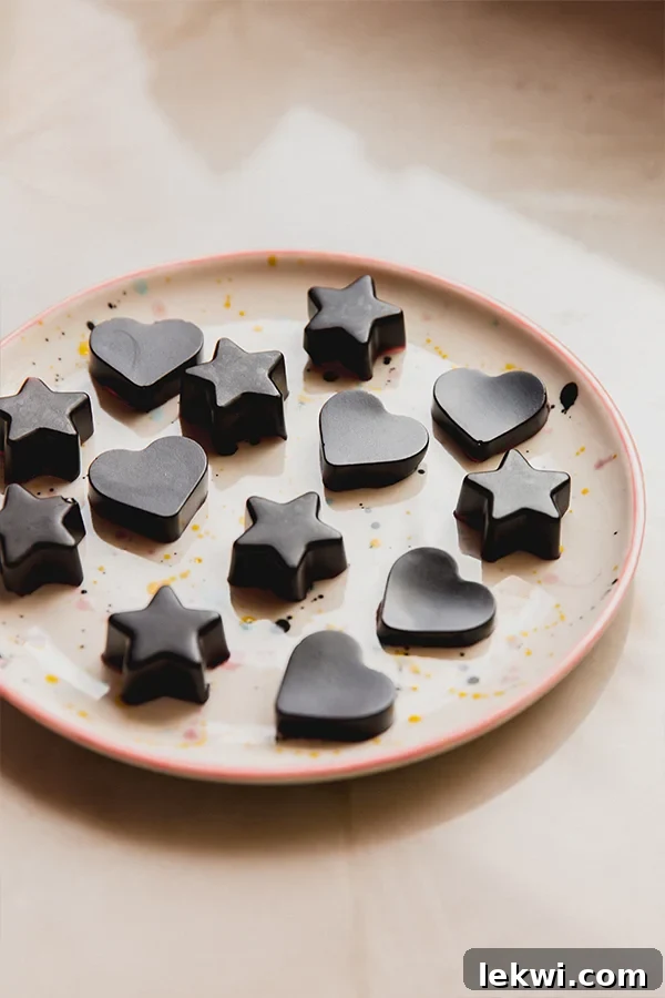 A plate full of elderberry syrup gummies sitting on a counter.