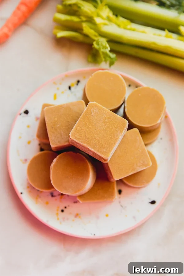 A beautiful stack of perfectly formed homemade beef bouillon cubes resting on a kitchen counter.