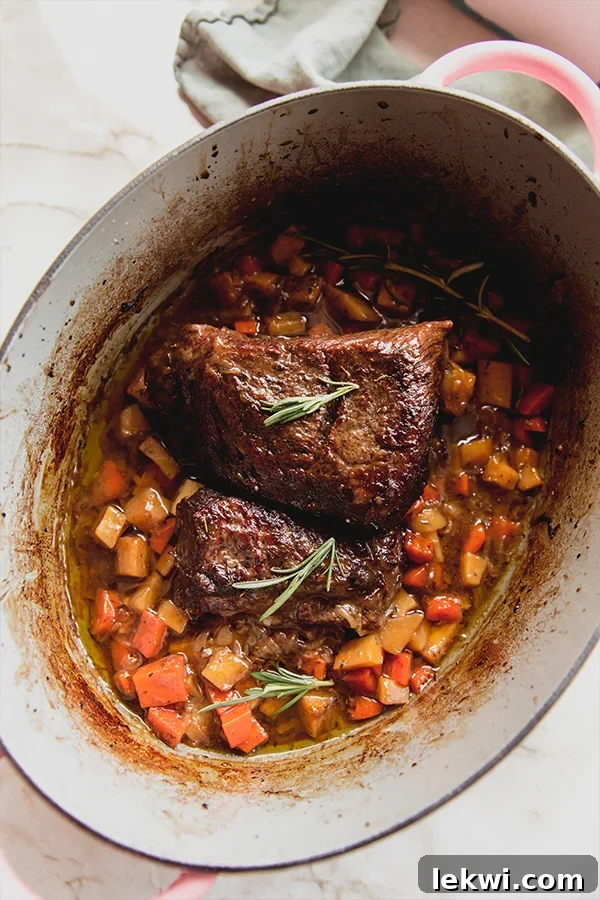 The apple cider braised pot roast after baking before slicing to be eaten.