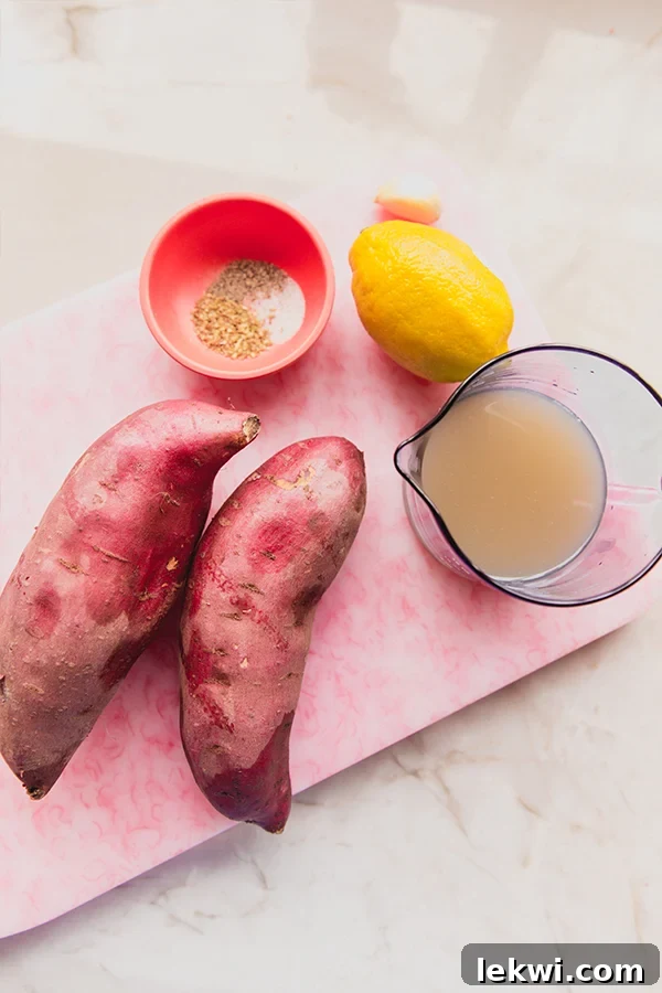 All of the ingredients to make Greek Lemon Style Sweet Potatoes before baking, neatly arranged.
