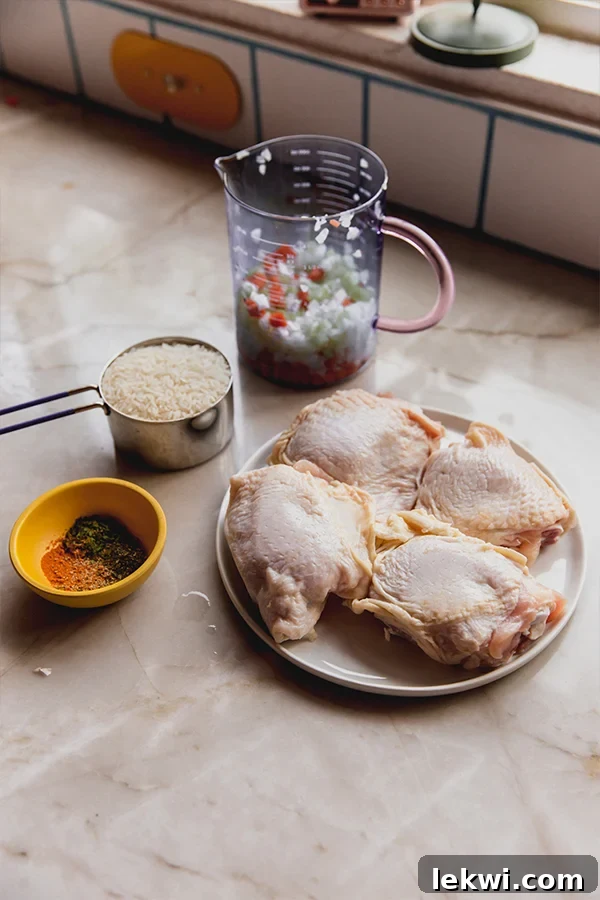 Greek lemon chicken thigh ingredients in separate bowls, and measuring cups. 