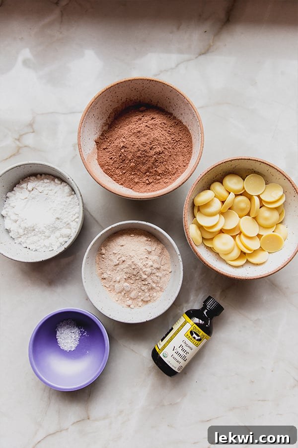 All the essential ingredients for making delicious homemade coconut milk chocolate bars, neatly arranged on a kitchen counter.