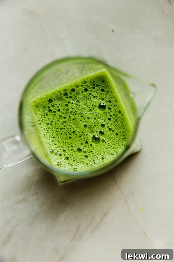 Matcha fully prepared in a creamer cup.