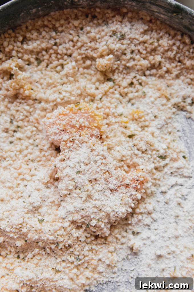 Dino-shaped nugget in bread crumbs.