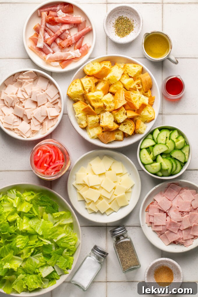 All the vibrant and fresh ingredients needed for Sub in a Tub Salad, neatly arranged.