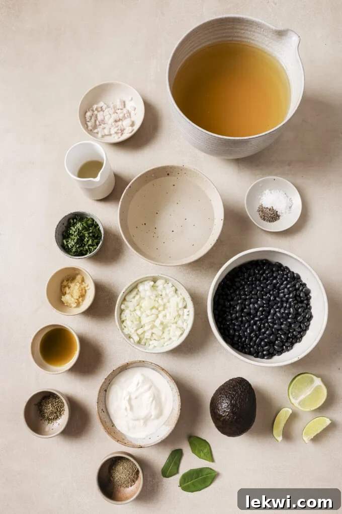 Refried bean ingredients in separate bowls all laid out.