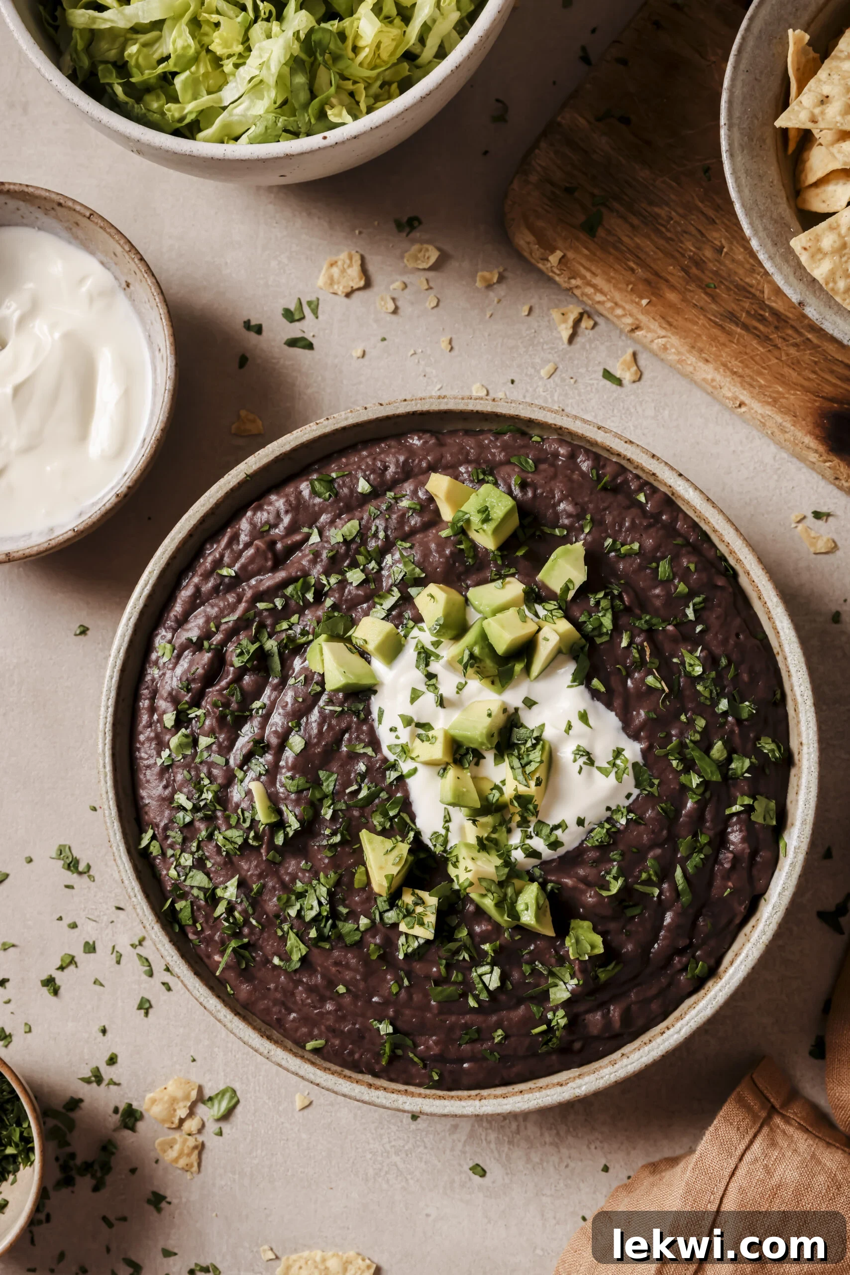Creamy refried black beans in an Instant Pot, ready to serve.