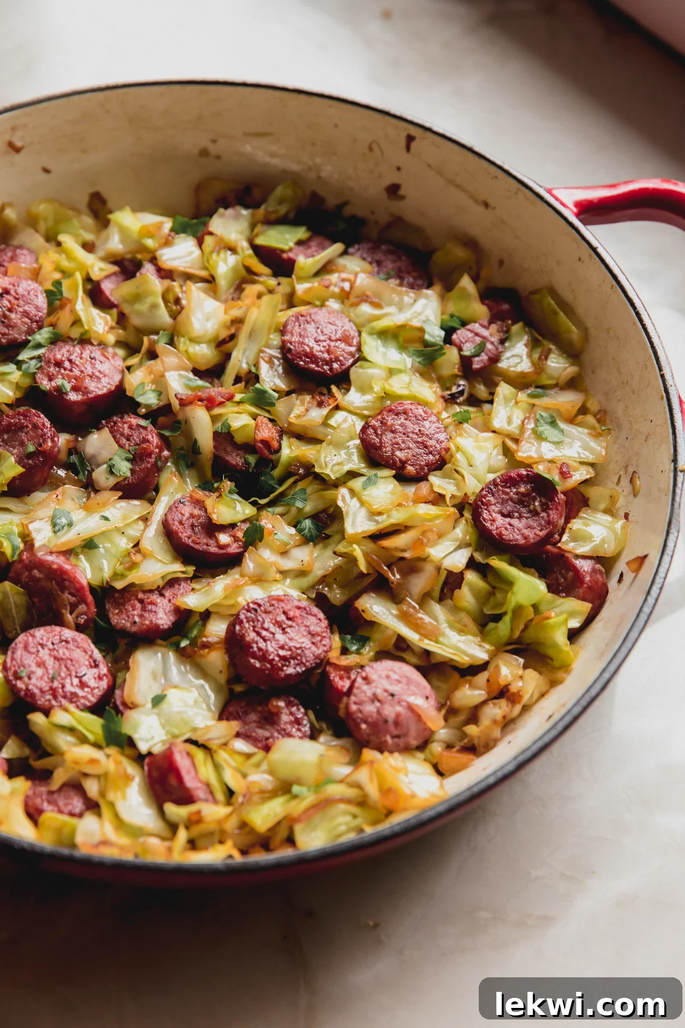 Southern cabbage and sausage in a large skillet.