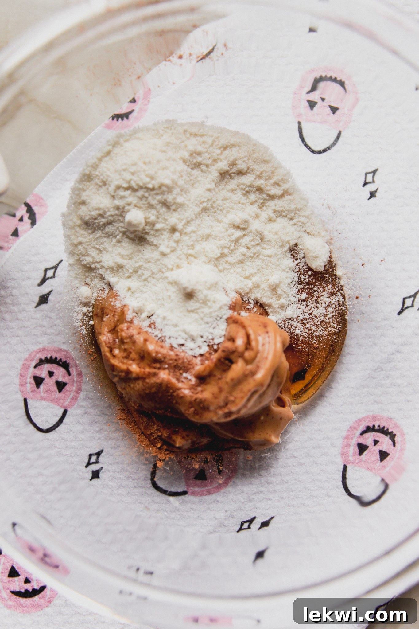 Almond butter, maple syrup and coconut flour unmixed in a bowl, before being combined into the filling.