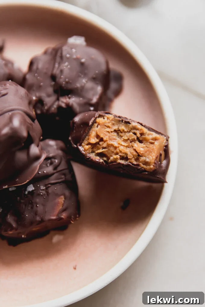 Mini butterfinger copycats on a platter with one bitten in half, showcasing the crunchy filling.