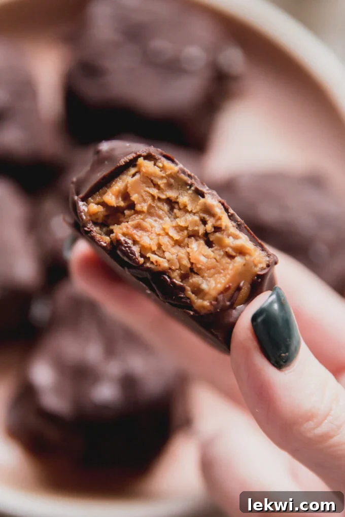 Mini butterfinger bitten in half, showing the crispy, flaky interior.