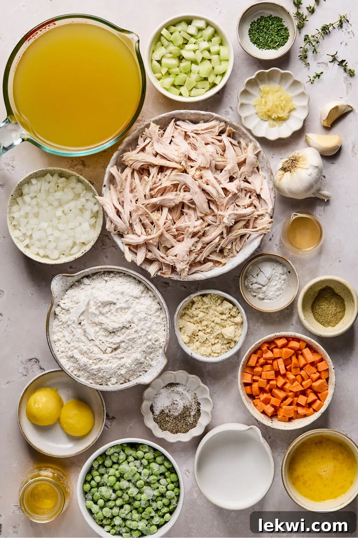 Chicken and dumpling ingredients laid out in separate bowls, ready for preparation.