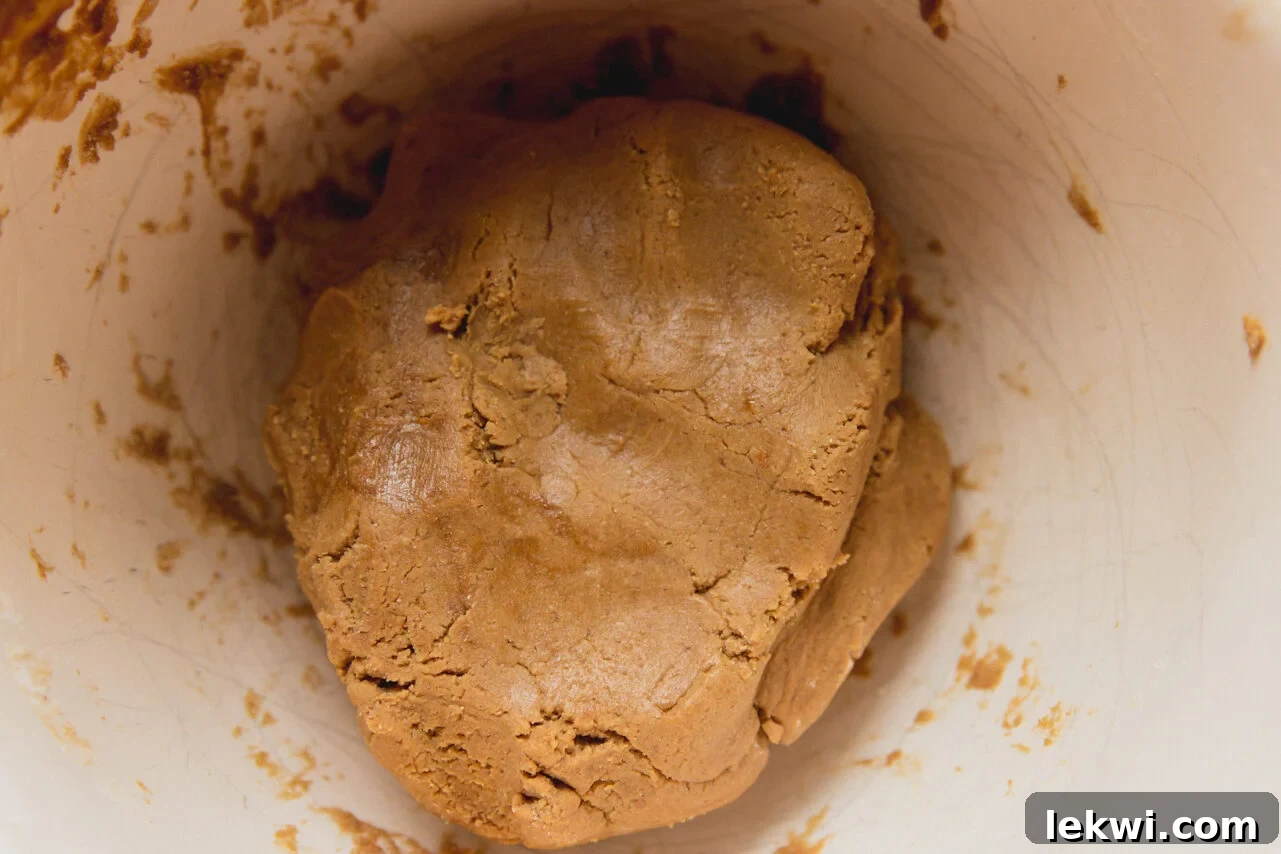 The gingerbread Rudolph reindeer cookie dough in a bowl, ready to be rolled.