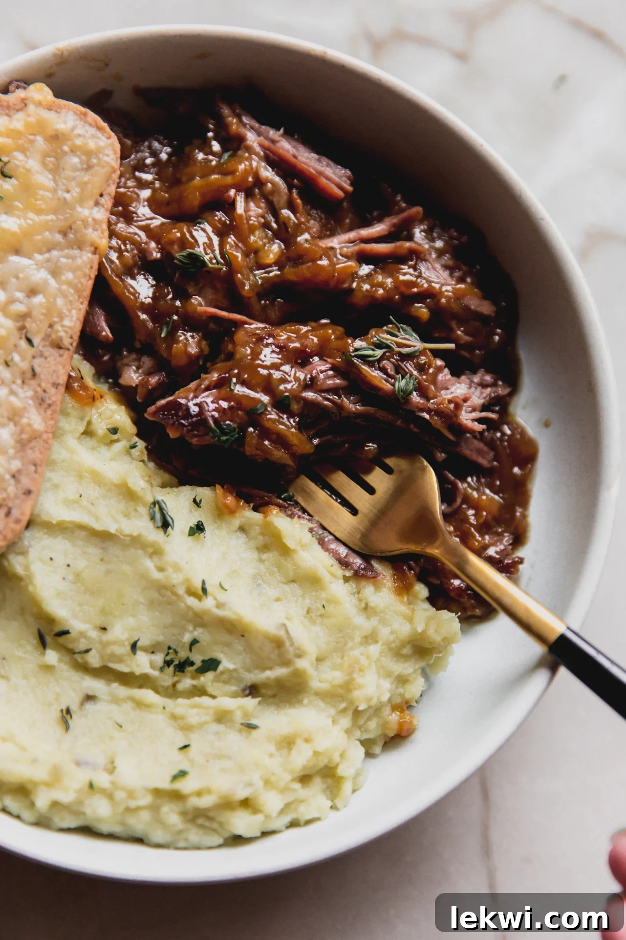 French onion pot roast with a side of mashed sweet potato and cheese toast.