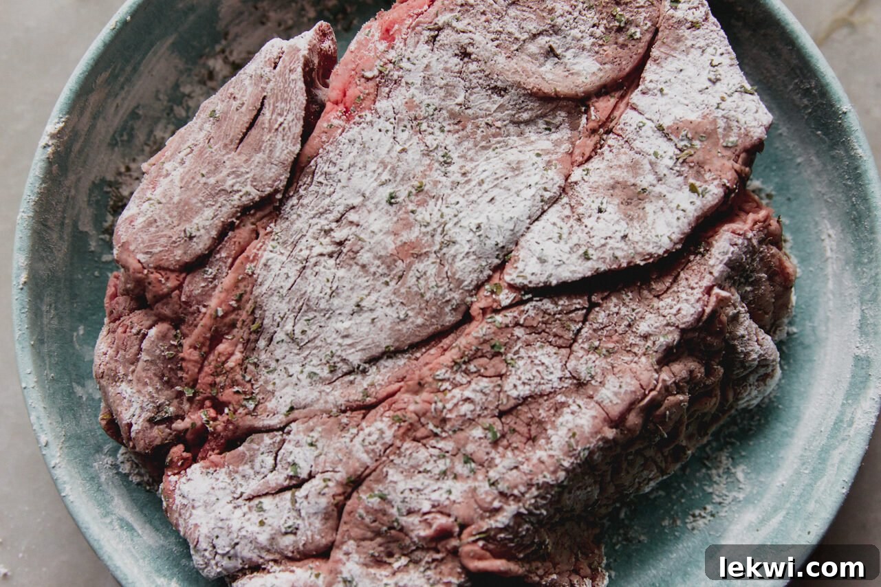 The meat covered in arrowroot starch before cooking.