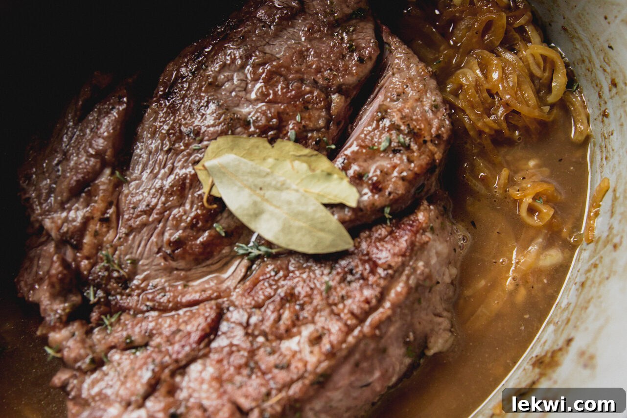 The pot roast in the Dutch oven before going in the oven. 