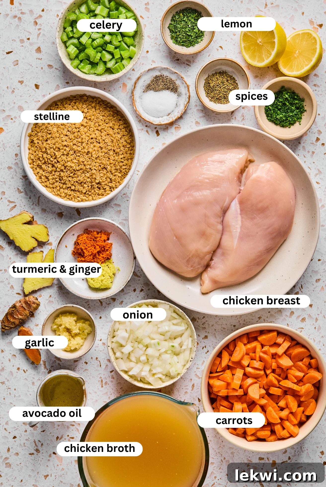 All the vibrant, fresh ingredients laid out for making the turmeric chicken soup.