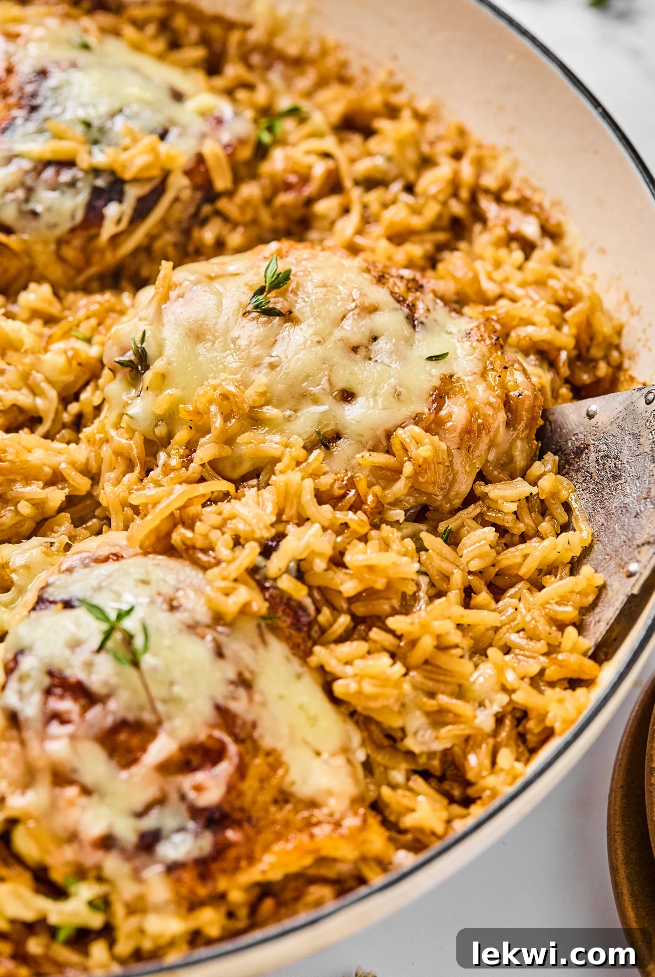 French onion chicken and rice in a large pan, beautifully cooked.