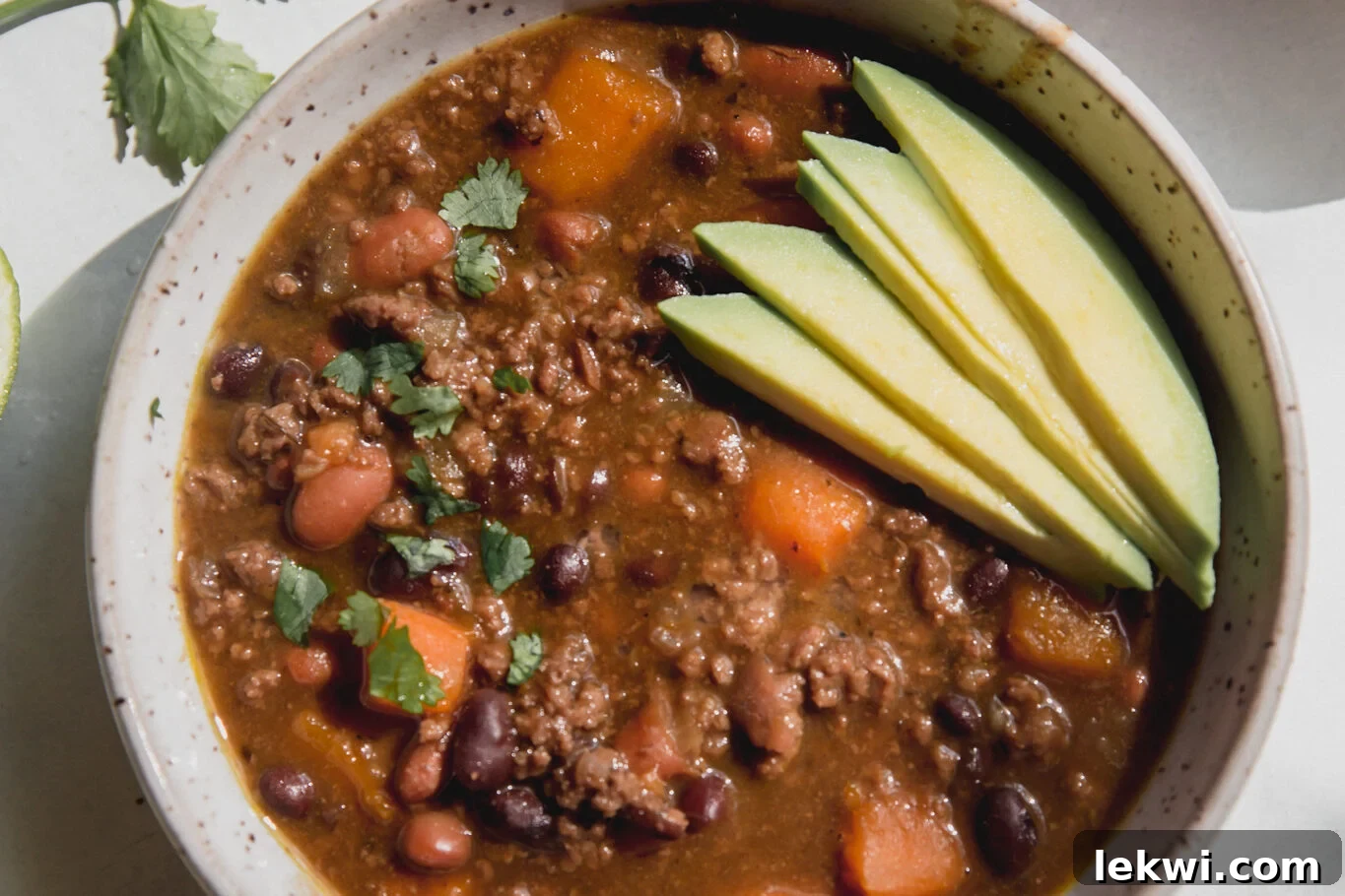 Hearty Nightshade Free Chili topped with fresh avocado slices.