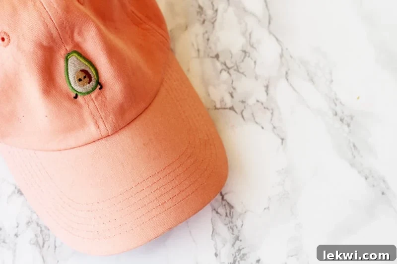 An orange hat with an avocado design, symbolizing comfort and joy.
