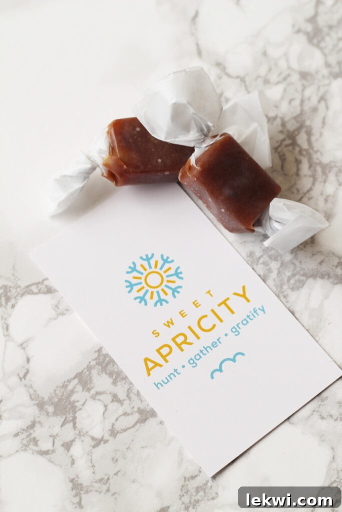Two glistening Sweet Apricity caramels, perfectly portioned and ready to enjoy, resting on a clean countertop.