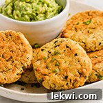 baked veggie nuggets on a plate with a side of guacamole.